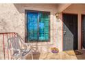 Inviting front porch featuring a security door, welcome mat, and an outdoor seating area at 455 S Delaware Dr # 106, Apache Junction, AZ 85120