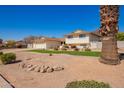 Home exterior featuring a two-car garage, well-maintained landscaping, and a private yard at 5226 W Tierra Buena Ln, Glendale, AZ 85306