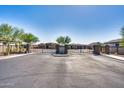 Gated entrance to the neighborhood featuring landscaping and a secure access point for residents at 8009 W Northview Ave, Glendale, AZ 85303