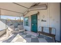 Cozy front porch featuring seating and charming decor elements at 8126 E Billings St, Mesa, AZ 85207