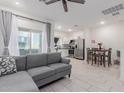 Open-concept living room with tiled floors, modern decor, and natural light creates a welcoming atmosphere at 8188 N 22Nd Dr, Phoenix, AZ 85021