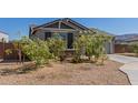 Single-story home with desert landscaping and a view of the front entryway at 9313 S 39Th Dr, Laveen, AZ 85339