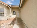 Inviting home entrance with security screen door and desert landscaping at 1052 W Paseo Way, Tempe, AZ 85283