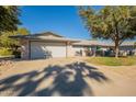 Charming single-story home with a two car garage and beautiful drought tolerant landscaping at 12946 W Maplewood Dr, Sun City West, AZ 85375