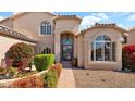 Beautiful home entrance surrounded by lush landscaping and charming benches for a welcoming curb appeal at 1302 E Voltaire Ave, Phoenix, AZ 85022