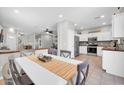 Open concept dining area next to a modern kitchen, perfect for entertaining Gathering and friends at 13534 W Young St, Surprise, AZ 85374