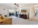 Bright living room featuring a private balcony and home office setup at 1720 E Thunderbird Rd # 2090, Phoenix, AZ 85022