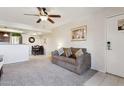 Inviting living room featuring neutral tones, a modern ceiling fan, and an open layout at 1720 E Thunderbird Rd # 2090, Phoenix, AZ 85022