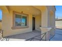 Covered front porch featuring detailed columns and a view of the home's entrance at 2296 S 235Th Dr, Buckeye, AZ 85326