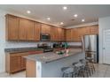 Spacious kitchen with granite countertops, stainless steel appliances, ample cabinetry, and a kitchen island at 25330 N 134Th Dr, Peoria, AZ 85383