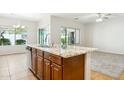 Kitchen island features granite counters, stainless steel dishwasher, and views to the backyard at 27127 N 54Th Ave, Phoenix, AZ 85083