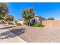 Home featuring manicured landscaping, a well-kept lawn, and a welcoming front entrance with sidewalk at 3020 E Tiffany Way, Gilbert, AZ 85298