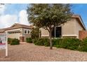 Home with a neatly maintained front yard, mature trees, and a private entrance with a well-kept lawn at 3020 E Tiffany Way, Gilbert, AZ 85298