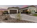Beautiful exterior showing the brick driveway of this home and desert landscaping at 4247 E Tonto Pl, Chandler, AZ 85249