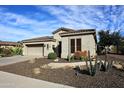 Attractive single-story home featuring desert landscaping and a two-car garage at 5405 S Marigold Way, Gilbert, AZ 85298