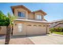 Charming two-story home features neutral stucco, two-car garage, tile roof and desert landscaping at 5527 W Tonopah Dr, Glendale, AZ 85308