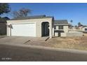 Attractive single-story home featuring a 2-car garage and a cozy entry courtyard at 7018 S 41St Pl, Phoenix, AZ 85042