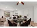Bright living room with dining area with elegant furnishings and access to the outdoor patio at 7777 E Main St # 258, Scottsdale, AZ 85251