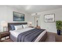Well-lit main bedroom featuring a large bed, bedside tables, lamps, and stylish decor at 7777 E Main St # 258, Scottsdale, AZ 85251