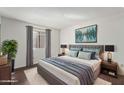 This gorgeous main bedroom is styled with a large plush bed and a gorgeous area rug at 7777 E Main St # 258, Scottsdale, AZ 85251