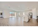 Spacious living room featuring an open floor plan, modern finishes, and sliding glass doors to the backyard at 855 W Peralta Pass, Apache Junction, AZ 85120