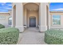 Grand entrance with stately columns and a welcoming double door design at 9167 E Tarantini Ln, Scottsdale, AZ 85260