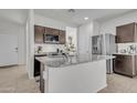 Modern kitchen featuring granite countertops, stainless steel appliances, and ample cabinet space at 10320 E Lupine Ln, Florence, AZ 85132