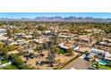 Aerial view of a desert neighborhood with mountain views at 11616 N Miller Rd, Scottsdale, AZ 85260