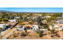 Exterior of a single-story home featuring a low-sloped red tile roof at 11616 N Miller Rd, Scottsdale, AZ 85260