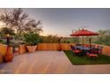 An outdoor patio with comfortable seating, an umbrella, and great views at 1489 Thrasher Ln, Wickenburg, AZ 85390