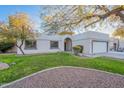 Inviting front exterior with a lush lawn and mature landscaping at 1601 E Elgin St, Chandler, AZ 85225