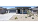 Lovely single-story home with stone pillar accents and a well-maintained front yard at 17996 W Camino De Oro --, Surprise, AZ 85387