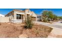 Charming single-story home featuring a two-car garage and low-maintenance landscaping at 18800 W Madison St, Buckeye, AZ 85326