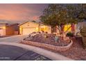 Beautiful single-story home with a desert landscape and a cozy front patio at 20151 N Riverbank Rd, Maricopa, AZ 85138