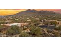 Expansive aerial view of a desert community nestled among the native vegetation at 35345 N Canyon Creek Ct, Carefree, AZ 85377