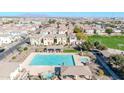 Aerial view of the community pool, clubhouse, and surrounding neighborhood at 4669 E Olney Ave, Gilbert, AZ 85234