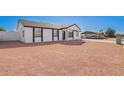 Spacious front yard with gravel landscaping leads to a newly painted home at 645 N 97Th St, Mesa, AZ 85207