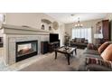 Warm and inviting living room featuring a fireplace and comfortable seating at 827 W Kesler Ln, Chandler, AZ 85225