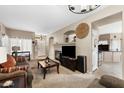 Cozy living room with fireplace and neutral decor at 827 W Kesler Ln, Chandler, AZ 85225