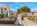 A modern walkway and desert landscaping lead to the charming house at 8443 E Sheridan St, Scottsdale, AZ 85257