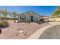 Charming single-story home boasts a covered carport and low maintenance desert landscaping at 8500 E Southern Ave # 551, Mesa, AZ 85209