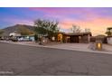 Inviting home with desert landscape, brick driveway, and mountain views in a quiet neighborhood at 10611 N 9Th Dr, Phoenix, AZ 85029