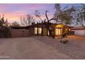 Lovely single-story home featuring desert landscaping, natural stone accents, and a private drive at 10611 N 9Th Dr, Phoenix, AZ 85029