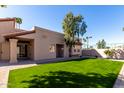 Charming single-story home with low maintenance landscaping, manicured lawn, and privacy, perfect for relaxing or entertaining at 11210 N 109Th St, Scottsdale, AZ 85259