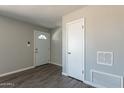 The entryway features gray paint and wood-look floors at 1715 E El Parque Dr, Tempe, AZ 85282