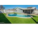 Enjoy outdoor living with a private pool, slide, and artificial grass at 1715 E El Parque Dr, Tempe, AZ 85282