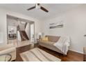 Comfortable living room with wood floors, staircase view, and neutral decor, creating a cozy atmosphere at 1893 S Sinova S Ave, Gilbert, AZ 85295