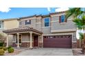 Charming two-story home with desert landscaping, covered entry, and an attached two-car garage at 25845 W Lynne Ln, Buckeye, AZ 85326