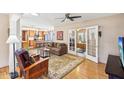 Inviting living room featuring hardwood floors, a ceiling fan, and french doors leading to another room at 32 E 14Th St, Tempe, AZ 85281