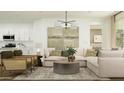 Bright and airy living room with neutral tones and modern furnishings at 3223 E Baler Dr, San Tan Valley, AZ 85140